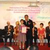 Lau Siu Ming presenting Hon Mention Cert to winner