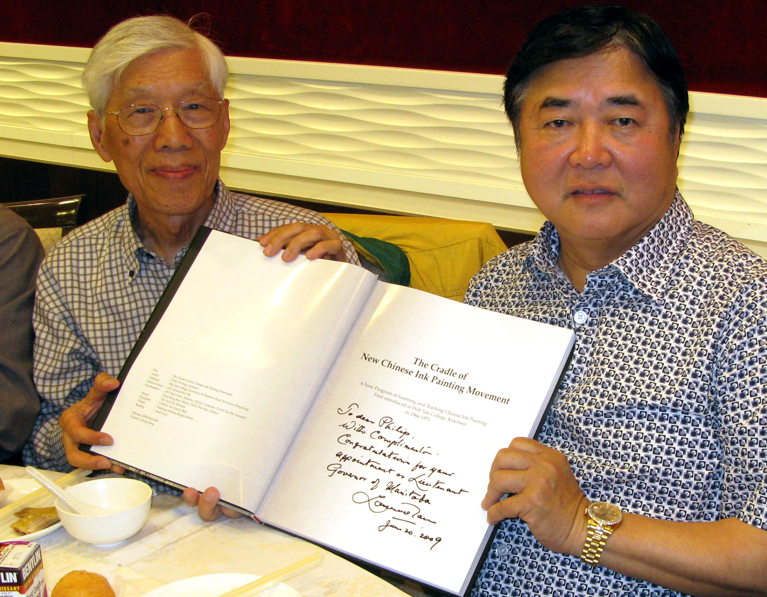 L Tam presents Cradle book to LG of Manitoba