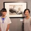 Hong Kong grand prize winner with her mother in front of the winning work
