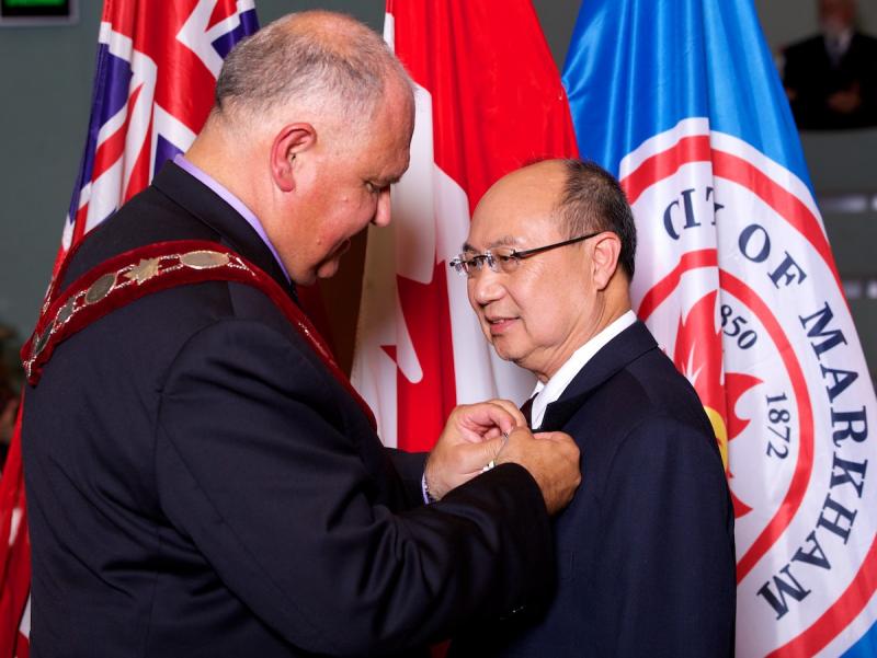 Peter Wong awarded medal by Markham Mayor F. Scarpitti